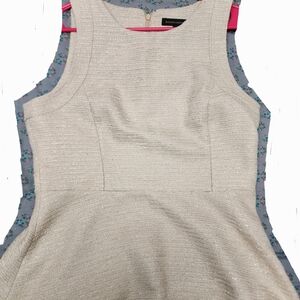 Elegant Cream Sleeveless Peplum Shell